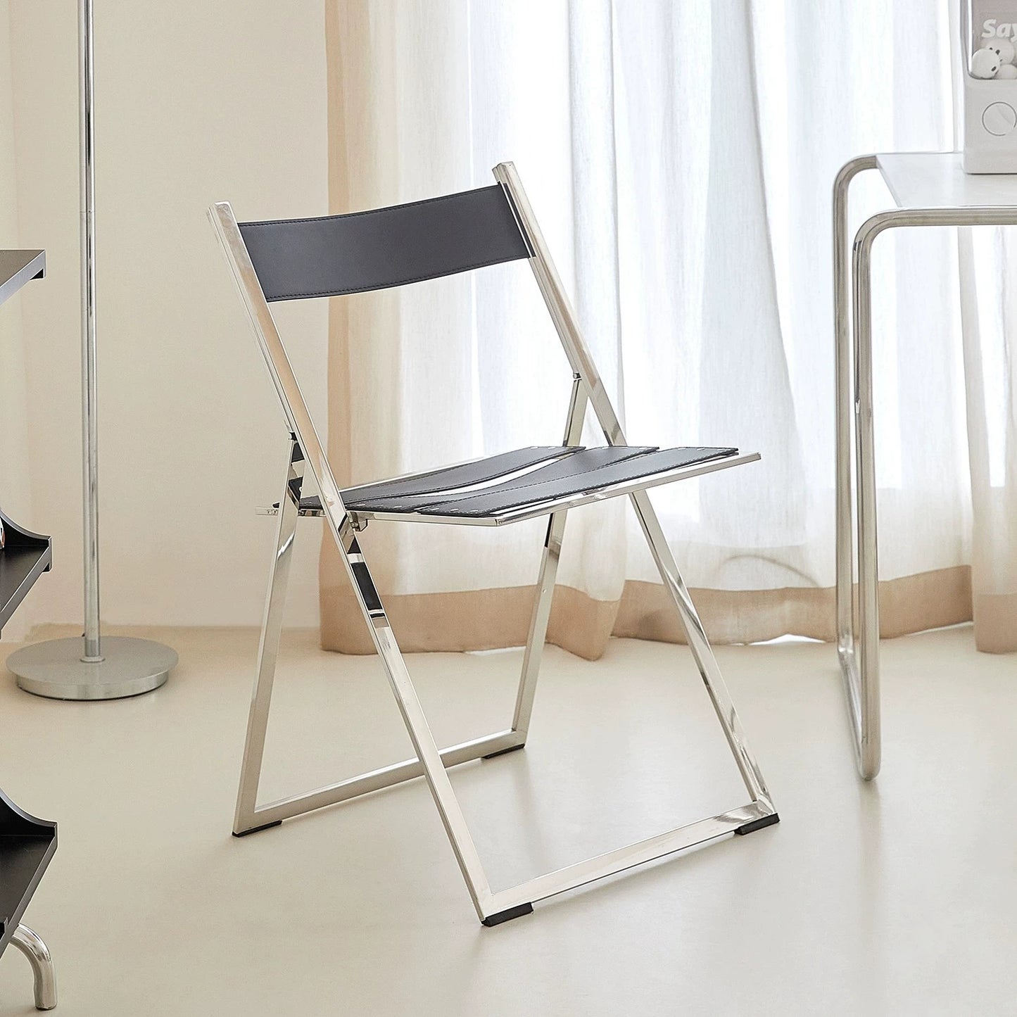 Klappbarer Esszimmerstuhl aus Edelstahl, nordischer moderner Stuhl für Zuhause und Café, leichter Luxus-Sattellederstuhl 